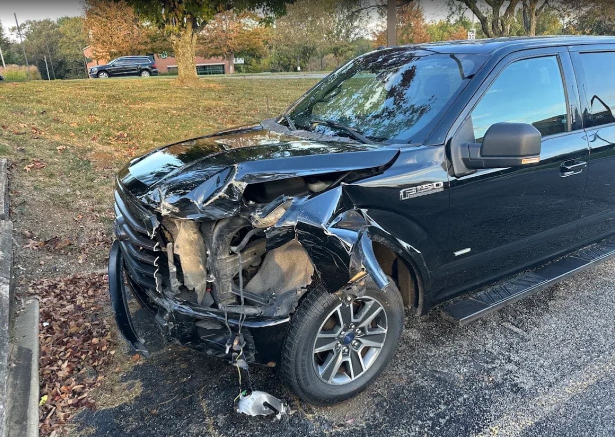 Ford F-150, front end: before repair. A Ford F-150 with severe front end collision damage